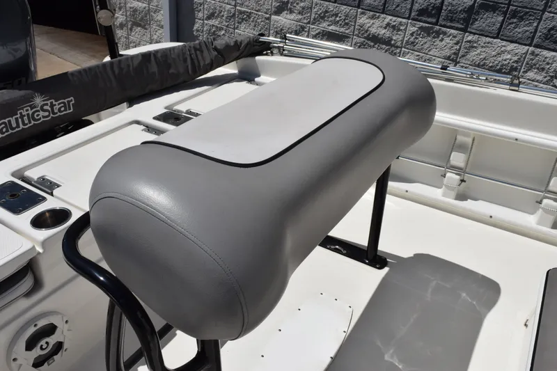 Slide: The Image of 2021 NauticStar 211 Hybrid boat interior with gray seating and cup holders. - 7
