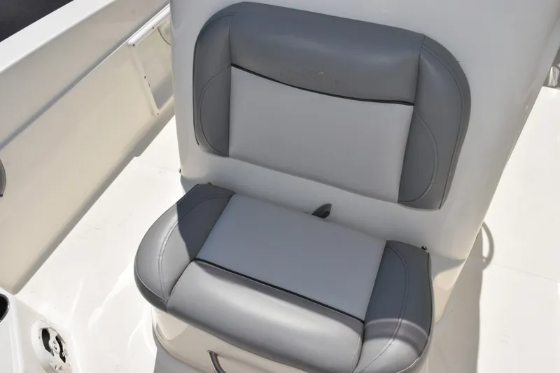 Slide: The Image of Gray cushioned seat on 2021 NauticStar 211 Hybrid boat, showcasing comfort and design. - 10
