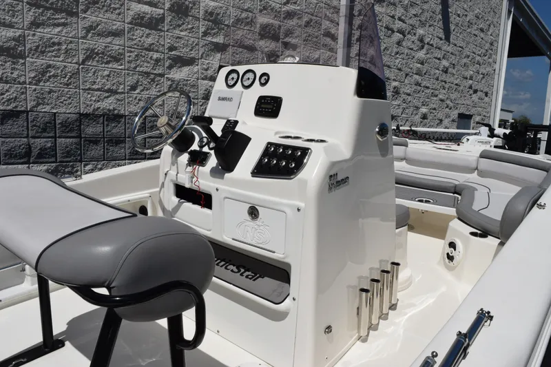 Slide: The Image of 2021 NauticStar 211 Hybrid boat interior with steering console and seating. - 6