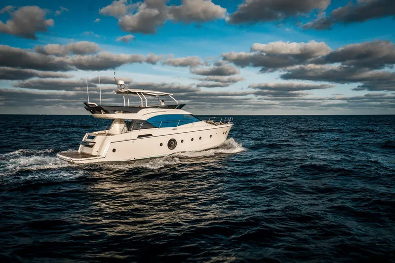 Slide: The Image of 2017 Beneteau Monte Carlo MC6 yacht cruising on open sea under cloudy sky. - 5