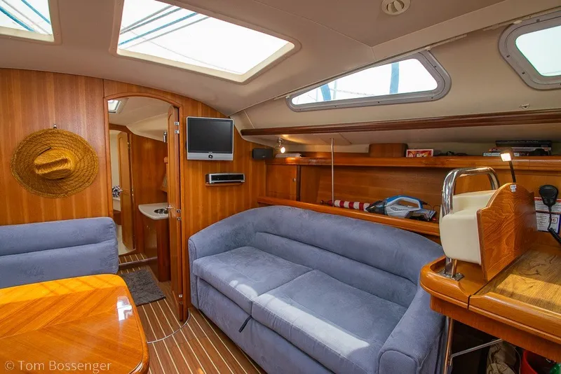Slide: The Image of Luxurious interior of 2007 Hunter 41 Aft Cockpit yacht with cozy seating and wood finish. - 17