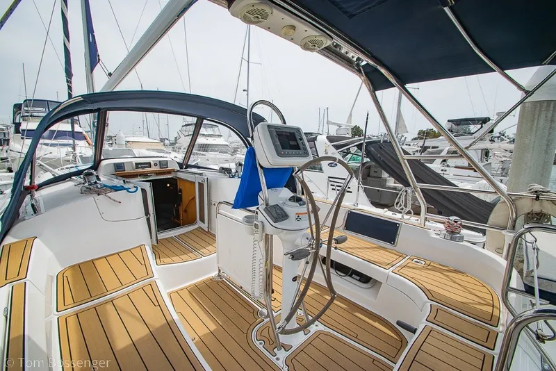 Slide: The Image of 2007 Hunter 41 Aft Cockpit sailboat interior with wooden deck and navigation equipment. - 32