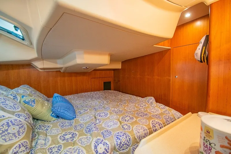 Slide: The Image of Cozy cabin interior of 2007 Hunter 41 Aft Cockpit yacht with patterned bedding. - 27