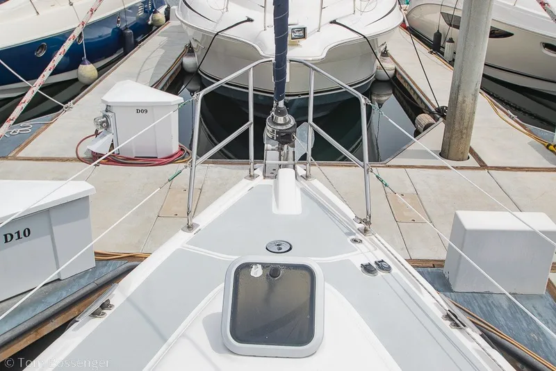 Slide: The Image of 2007 Hunter 41 Aft Cockpit sailboat docked at marina, view from bow. - 45