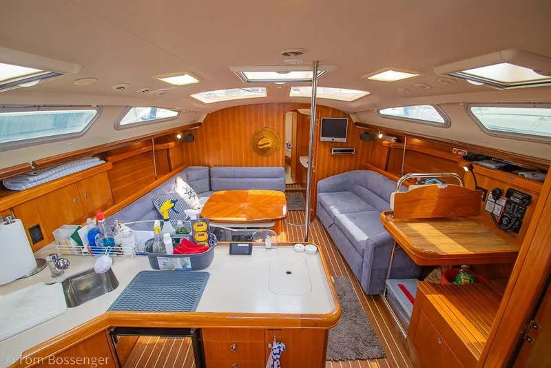 Slide: The Image of Interior of 2007 Hunter 41 Aft Cockpit yacht with cozy seating and wooden finishes. - 9