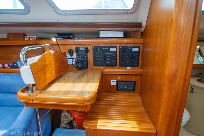 Slide: The Image of 2007 Hunter 41 Aft Cockpit interior with navigation station and control panels. - 29