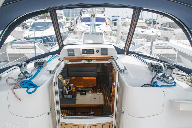 Slide: The Image of Aft cockpit view of 2007 Hunter 41 sailboat, showcasing interior and marina setting. - 8