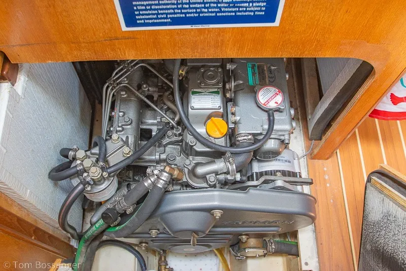 Slide: The Image of Engine compartment of a 2007 Hunter 41 Aft Cockpit sailboat, showcasing detailed mechanics. - 51