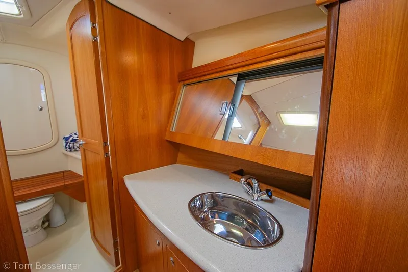 Slide: The Image of Luxurious bathroom interior of 2007 Hunter 41 Aft Cockpit yacht with wooden cabinetry. - 24