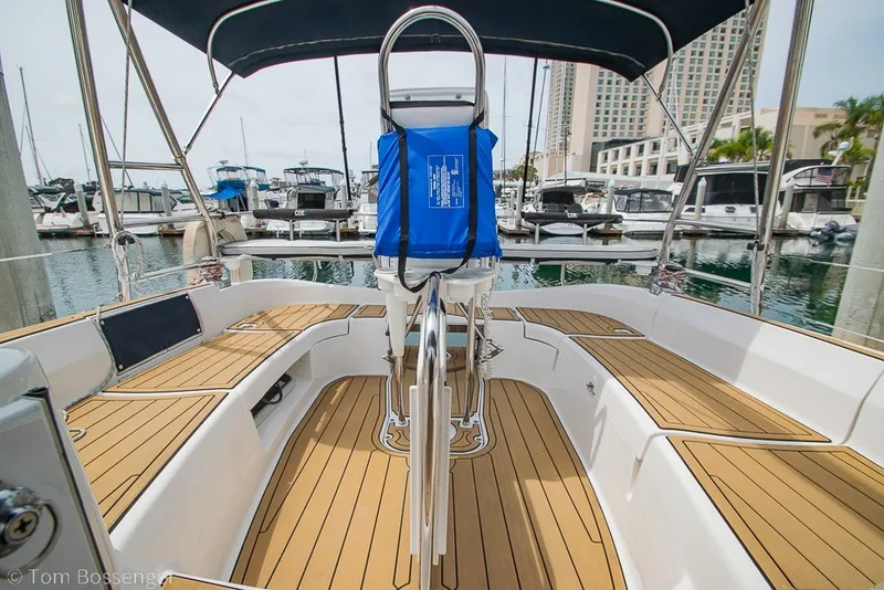 Slide: The Image of 2007 Hunter 41 Aft Cockpit sailboat with teak deck in marina setting. - 35