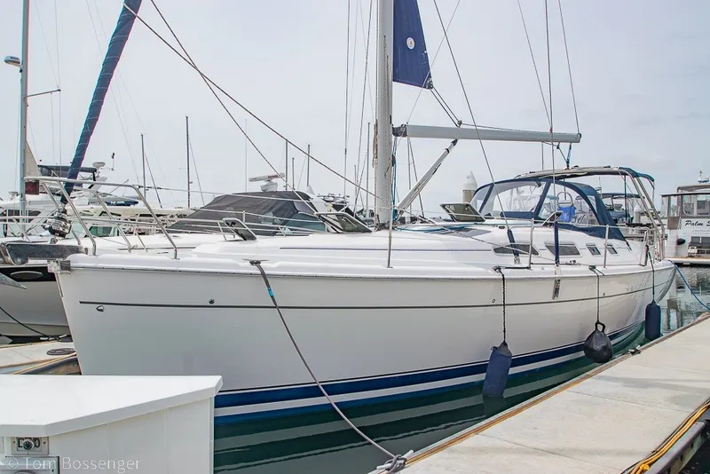 Slide: The Image of 2007 Hunter 41 Aft Cockpit sailboat docked at marina, side view. - 2