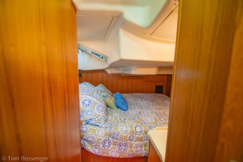 Slide: The Image of Cozy cabin interior of 2007 Hunter 41 Aft Cockpit sailboat with patterned bedding. - 26