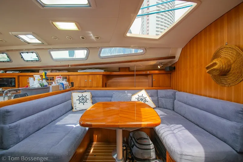 Slide: The Image of Interior of 2007 Hunter 41 Aft Cockpit yacht with cozy seating and wooden table. - 18