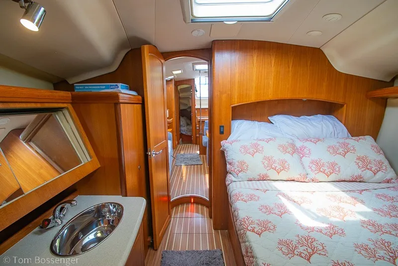 Slide: The Image of Luxurious 2007 Hunter 41 Aft Cockpit yacht interior with cozy bedroom and elegant wood finish. - 23