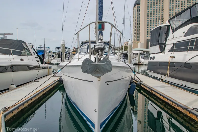 Slide: The Image of 2007 Hunter 41 Aft Cockpit sailboat docked in a marina, surrounded by other boats. - 3