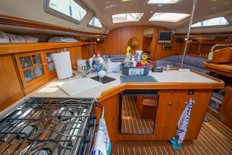 Slide: The Image of Interior of 2007 Hunter 41 Aft Cockpit yacht with modern kitchen and wooden cabinetry. - 14