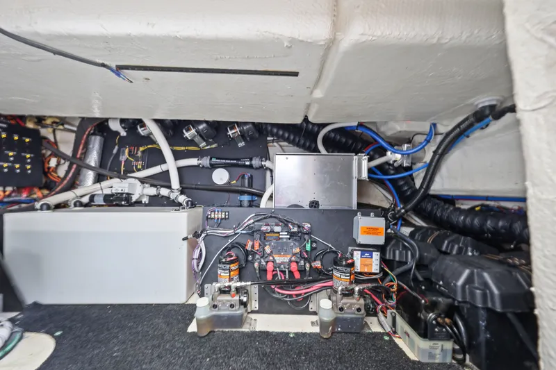 Slide: The Image of Engine compartment of a 2021 Regal 38 XO boat, showcasing wiring and components. - 47