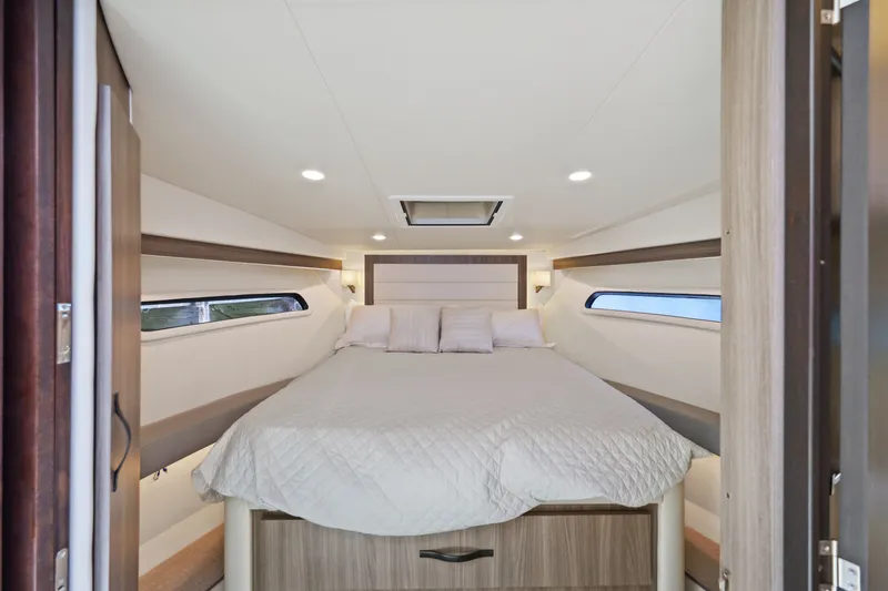 Slide: The Image of Luxurious cabin interior of 2021 Regal 38 XO yacht with cozy bed and modern design. - 35