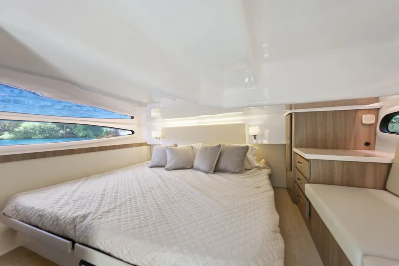Slide: The Image of Luxurious cabin interior of 2021 Regal 38 XO yacht with cozy bed and modern design. - 37