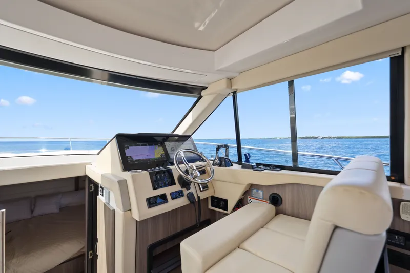 Slide: The Image of Luxurious 2021 Regal 38 XO yacht interior with modern helm and ocean view. - 26
