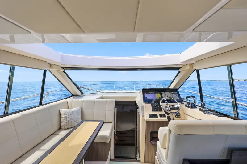 Slide: The Image of Interior view of 2021 Regal 38 XO yacht with luxurious seating and modern helm. - 21