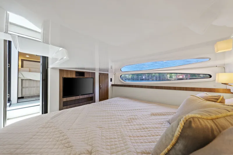Slide: The Image of Luxurious interior cabin of 2021 Regal 38 XO yacht with modern amenities and scenic windows. - 40