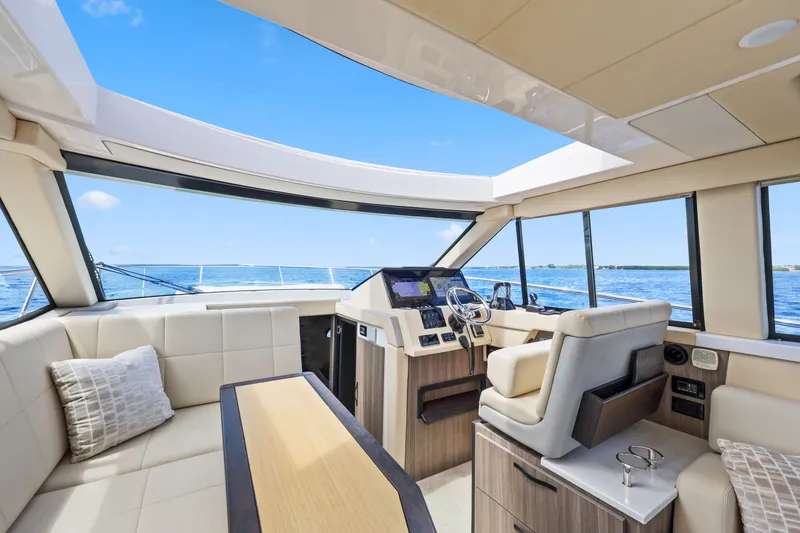 Slide: The Image of Luxurious interior of 2021 Regal 38 XO yacht with panoramic windows and plush seating. - 22