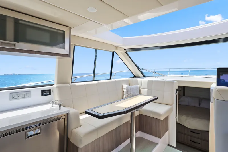 Slide: The Image of Luxurious interior of 2021 Regal 38 XO yacht with ocean view and modern seating. - 23