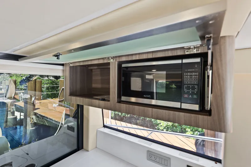 Slide: The Image of Modern kitchen interior of 2021 Regal 38 XO yacht with built-in microwave. - 32