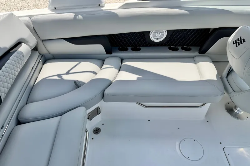 Slide: The Image of 2023 Four Winns HD8 OB boat interior with luxurious seating and modern design. - 20