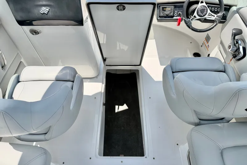 Slide: The Image of 2023 Four Winns HD8 OB boat interior with sleek seating and modern dashboard. - 33