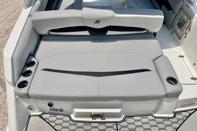 Slide: The Image of 2023 Four Winns HD8 OB boat with sleek seating and integrated cup holders. - 25