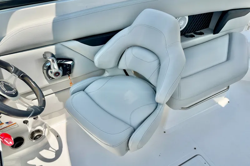 Slide: The Image of 2023 Four Winns HD8 OB boat interior with sleek steering and comfortable seating. - 12