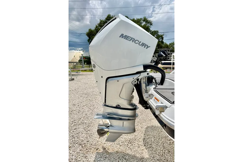 Slide: The Image of 2023 Four Winns HD8 OB boat with Mercury outboard motor, displayed outdoors. - 38