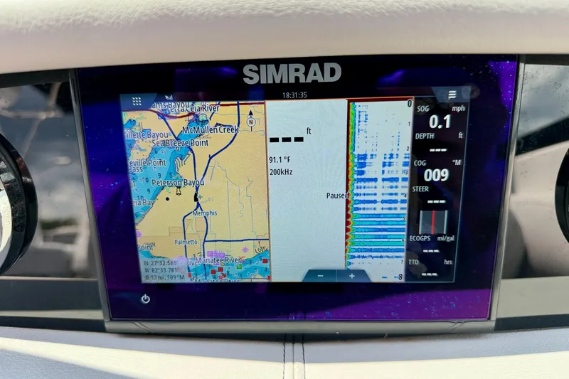 Slide: The Image of Simrad navigation display on 2023 Four Winns HD8 OB boat, showing map and sonar data. - 15