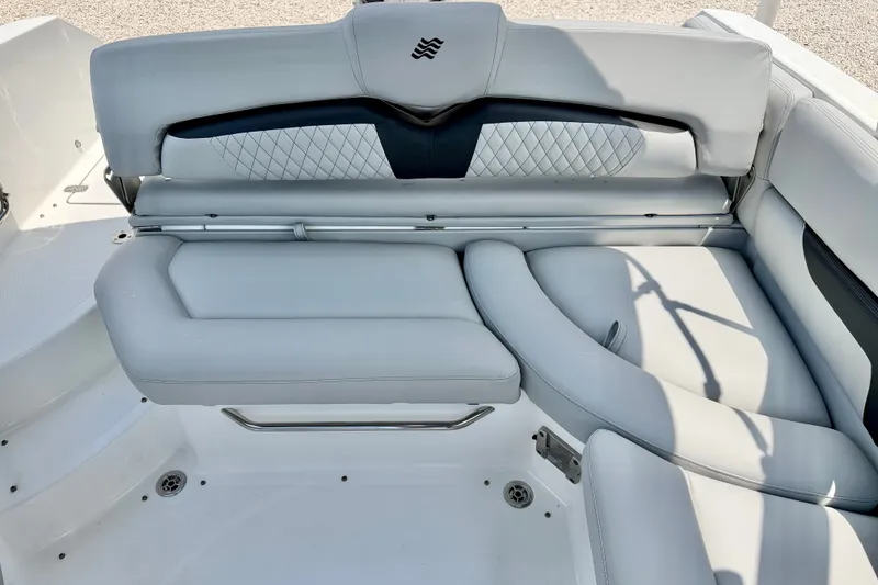 Slide: The Image of 2023 Four Winns HD8 OB boat interior with luxurious white seating and elegant design. - 21