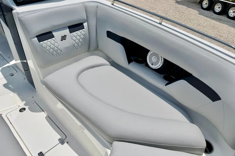Slide: The Image of 2023 Four Winns HD8 OB boat interior with luxurious seating and speaker system. - 11