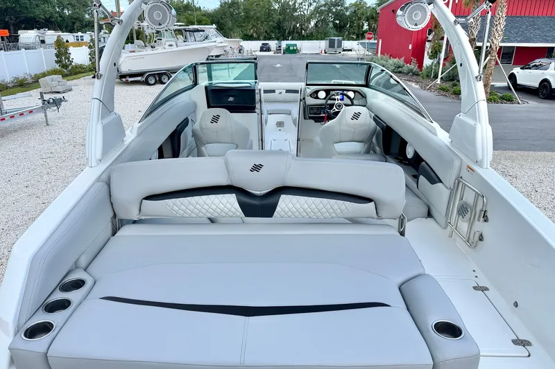 Slide: The Image of 2023 Four Winns HD8 OB boat interior with luxurious seating and modern dashboard. - 24