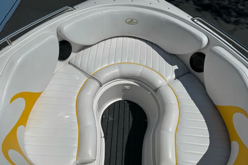 Slide: The Image of 2006 Ebbtide 2100 Bow Rider boat interior with white and yellow seating. - 11