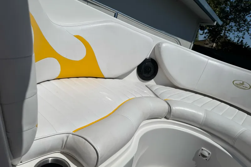 Slide: The Image of 2006 Ebbtide 2100 Bow Rider interior with white and yellow seating. - 25