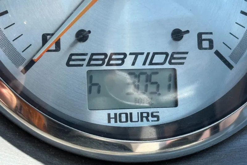 Slide: The Image of Close-up of Ebbtide 2100 Bow Rider 2006 hour meter displaying 305.1 hours. - 23