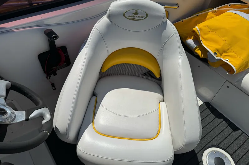 Slide: The Image of White and yellow seat on 2006 Ebbtide 2100 Bow Rider boat interior. - 15