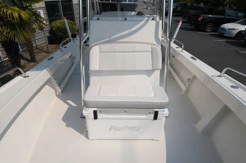 Slide: The Image of 2024 Parker 2100 Center Console boat interior with cushioned seating and storage. - 11
