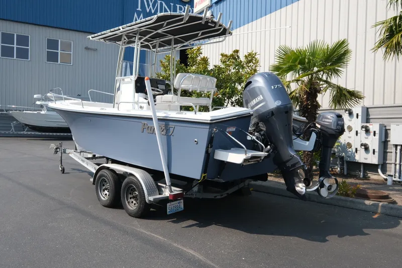 Slide: The Image of 2024 Parker 2100 Center Console boat on trailer with Yamaha outboard motor. - 4