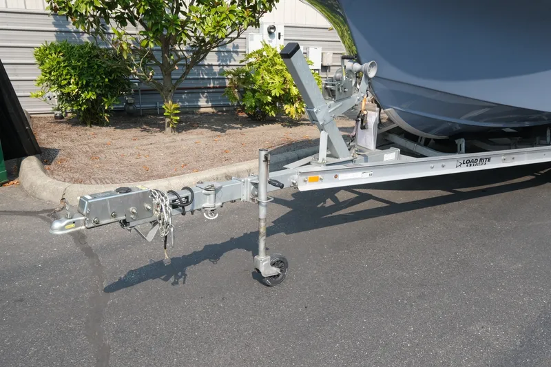 Slide: The Image of Trailer hitch of a 2024 Parker 2100 Center Console boat on Load Rite trailer. - 14