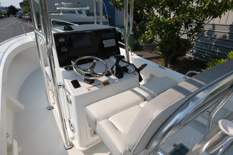 Slide: The Image of 2024 Parker 2100 Center Console boat interior with steering wheel and controls. - 8