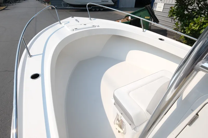 Slide: The Image of 2024 Parker 2100 Center Console boat interior with seating and stainless steel railings. - 10