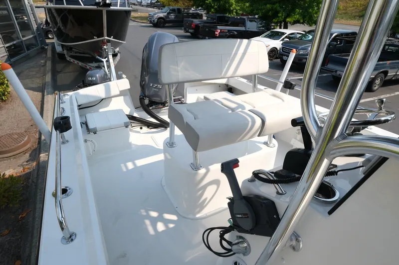 Slide: The Image of 2024 Parker 2100 Center Console boat interior with seating and controls. - 12