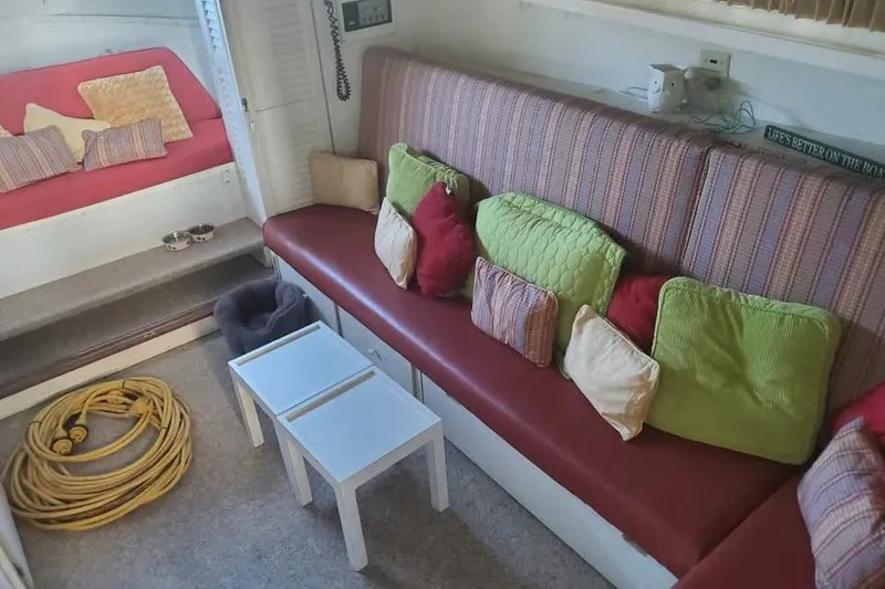 Slide: The Image of Interior of 1971 Chris-Craft 38 Commander with colorful cushions and seating area. - 11