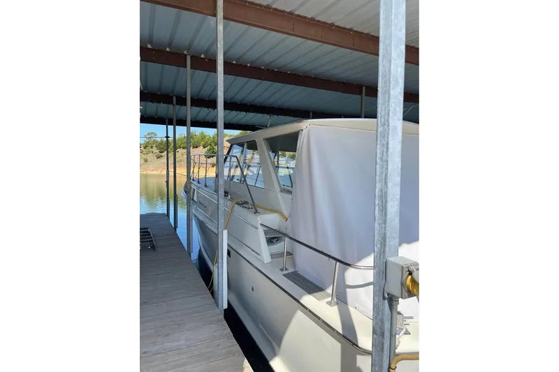 Slide: The Image of 1971 Chris-Craft 38 Commander docked under a covered marina. - 3
